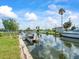 Canal view with dock showcasing waterfront living and boating access at 13316 Carol Dr, Hudson, FL 34667