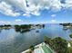 Panoramic view of the waterfront, showcasing sparkling water, lush greenery, and on-site recreation shuffle board at 1365 Snell Isle Ne Blvd # 6E, St Petersburg, FL 33704