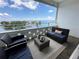 Serene balcony with views of the water, comfortable seating area, and decor, ideal for relaxation and enjoyment at 1365 Snell Isle Ne Blvd # 6E, St Petersburg, FL 33704
