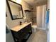Nicely appointed bathroom features tile floors, updated vanity, and tiled shower with curtain at 1365 Snell Isle Ne Blvd # 6E, St Petersburg, FL 33704