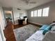Bedroom with wood floors and large windows showing desk space at 1365 Snell Isle Ne Blvd # 6E, St Petersburg, FL 33704