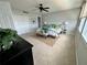Comfortable bedroom with a ceiling fan, ensuite, and carpet floors at 1365 Snell Isle Ne Blvd # 6E, St Petersburg, FL 33704