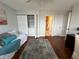 Comfortable bedroom includes closet with washer/dryer, desk, and ensuite bathroom at 1365 Snell Isle Ne Blvd # 6E, St Petersburg, FL 33704