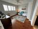 Cozy bedroom with desk area, wood floors, and plantation shutters at 1365 Snell Isle Ne Blvd # 6E, St Petersburg, FL 33704