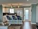 Open kitchen with seating at the island, modern appliances, and tile backsplash at 1365 Snell Isle Ne Blvd # 6E, St Petersburg, FL 33704