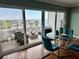 Charming living room features floor-to-ceiling windows with a scenic view, a glass dining table, and ample seating at 1365 Snell Isle Ne Blvd # 6E, St Petersburg, FL 33704