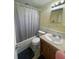 Standard bathroom featuring a shower-tub combination and neutral-toned vanity at 14935 Ogden Loop, Odessa, FL 33556