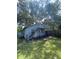 Exterior side view of the home with stairs and small upstairs patio at 14935 Ogden Loop, Odessa, FL 33556