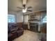 Cozy living room with tiled flooring and fireplace at 14935 Ogden Loop, Odessa, FL 33556