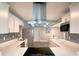 Beautiful kitchen featuring stainless steel appliances, quartz countertops, and white cabinets at 1554 Elmwood St, Clearwater, FL 33755