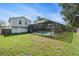 Enjoy the beautiful backyard with a private screened in pool, perfect for entertaining at 15612 Farnsworth Ln, Tampa, FL 33624