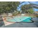 Gorgeous pool with a relaxing waterfall and a hot tub to unwind with at 15612 Farnsworth Ln, Tampa, FL 33624