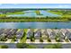Aerial view of a lovely neighborhood with waterfront homes and lush green surroundings at 1604 Acadia Harbor Pl, Brandon, FL 33511