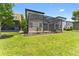 Green backyard features the home's covered and screened-in patio at 1604 Acadia Harbor Pl, Brandon, FL 33511