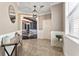 Bright foyer featuring elegant wall paneling, and a view to the dining room at 1604 Acadia Harbor Pl, Brandon, FL 33511