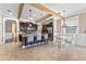 Open concept kitchen features a central island with seating, stainless appliances, and adjacent dining area at 1604 Acadia Harbor Pl, Brandon, FL 33511