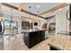 Spacious kitchen with granite countertops, large island, stainless steel appliances, and a view to the living room at 1604 Acadia Harbor Pl, Brandon, FL 33511