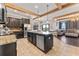 Spacious kitchen island with granite countertops, stainless steel appliances, and an open-concept layout at 1604 Acadia Harbor Pl, Brandon, FL 33511