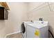 A simple laundry room with a washer and dryer at 1604 Acadia Harbor Pl, Brandon, FL 33511