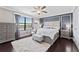 Main bedroom with hardwood floors, modern design, and large windows bringing in natural light at 1604 Acadia Harbor Pl, Brandon, FL 33511