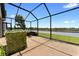 Enjoy relaxing lake views on this covered screened lanai patio area at 1604 Acadia Harbor Pl, Brandon, FL 33511