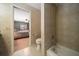 Modern bathroom includes a bathtub, shower, and neutral tile design at 1681 Long Bow Ln, Clearwater, FL 33764