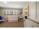 Bright bedroom provides a calm and inviting space with an ensuite bathroom at 1681 Long Bow Ln, Clearwater, FL 33764