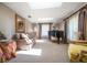 Bright bonus room with a grand piano, skylights, and elegant furnishings at 1681 Long Bow Ln, Clearwater, FL 33764