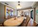 Inviting dining room with an extended table and views into the living area and entry at 1681 Long Bow Ln, Clearwater, FL 33764