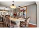 Elegant dining room featuring a large table with seating for eight and mirrored accents at 1681 Long Bow Ln, Clearwater, FL 33764