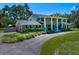 Classic home featuring a circular driveway, and traditional design elements at 1681 Long Bow Ln, Clearwater, FL 33764