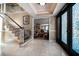 Spacious foyer featuring marble floors, an elegant staircase, and views into the formal living spaces at 1681 Long Bow Ln, Clearwater, FL 33764