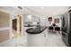 Bright eat-in kitchen equipped with white cabinetry, stainless appliances, and marble tile flooring at 1681 Long Bow Ln, Clearwater, FL 33764