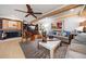 Spacious living room featuring stylish decor, a fireplace, and an open layout at 1681 Long Bow Ln, Clearwater, FL 33764