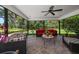 Comfortable screened patio features cozy seating, providing an ideal space for relaxation and outdoor enjoyment at 1681 Long Bow Ln, Clearwater, FL 33764
