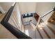 Staircase overlooking entry with carpet and white railing at 1681 Long Bow Ln, Clearwater, FL 33764