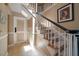 Staircase with carpet and wood railing at 1681 Long Bow Ln, Clearwater, FL 33764