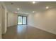 Spacious living room features recessed lighting and sliding glass doors to the backyard at 18848 Indian Rock Pl, Lakewood Ranch, FL 34211