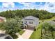 Beautiful two-story home featuring a paver driveway, well maintained landscaping, and a two-car garage at 19309 Prairie Tree Pl, Tampa, FL 33647