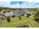 Spacious backyard featuring well-maintained lawn and screened in patio at 19309 Prairie Tree Pl, Tampa, FL 33647