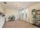 Bright bonus room with shelving, white cabinets, a vanity, and plenty of natural light at 19309 Prairie Tree Pl, Tampa, FL 33647
