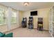 Vibrant game room featuring classic arcade games, bar stools, and a flat screen television at 19309 Prairie Tree Pl, Tampa, FL 33647