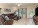 Inviting living room with comfortable seating, neutral decor, and abundant natural light at 19309 Prairie Tree Pl, Tampa, FL 33647