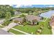 Aerial shot of a landscaped house with an attached two car garage and lake views at 2202 Hickory Ridge Dr, Valrico, FL 33596
