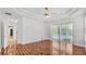 Bright bedroom with wood floors and sliding doors to the outdoor patio and pool at 2202 Hickory Ridge Dr, Valrico, FL 33596
