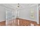 Bright bedroom with wood floors, tray ceiling, and sliding doors to the outdoor patio at 2202 Hickory Ridge Dr, Valrico, FL 33596