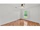 This bedroom features laminate floors, a large window with shutters, and a closet at 2202 Hickory Ridge Dr, Valrico, FL 33596
