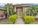 Inviting front entrance with well-kept landscaping and walkway leading to the front door at 2202 Hickory Ridge Dr, Valrico, FL 33596