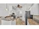 Kitchen with granite countertops, stainless steel appliances, white cabinets, and breakfast bar at 2202 Hickory Ridge Dr, Valrico, FL 33596