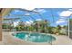 Enclosed pool with a spa and plenty of foliage and trees at 2202 Hickory Ridge Dr, Valrico, FL 33596